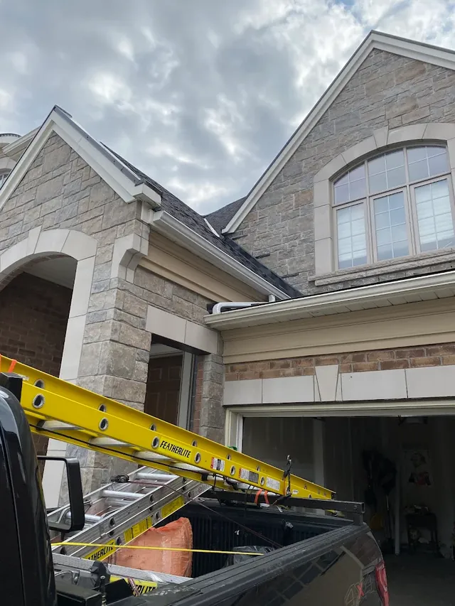 Roofing crew's ladder set up at a Richmond Hill home